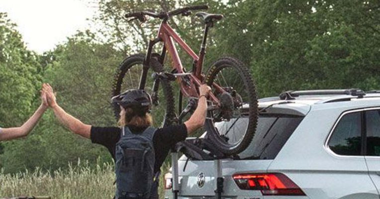 Trunk Mount Racks with bike and the man doing hi5