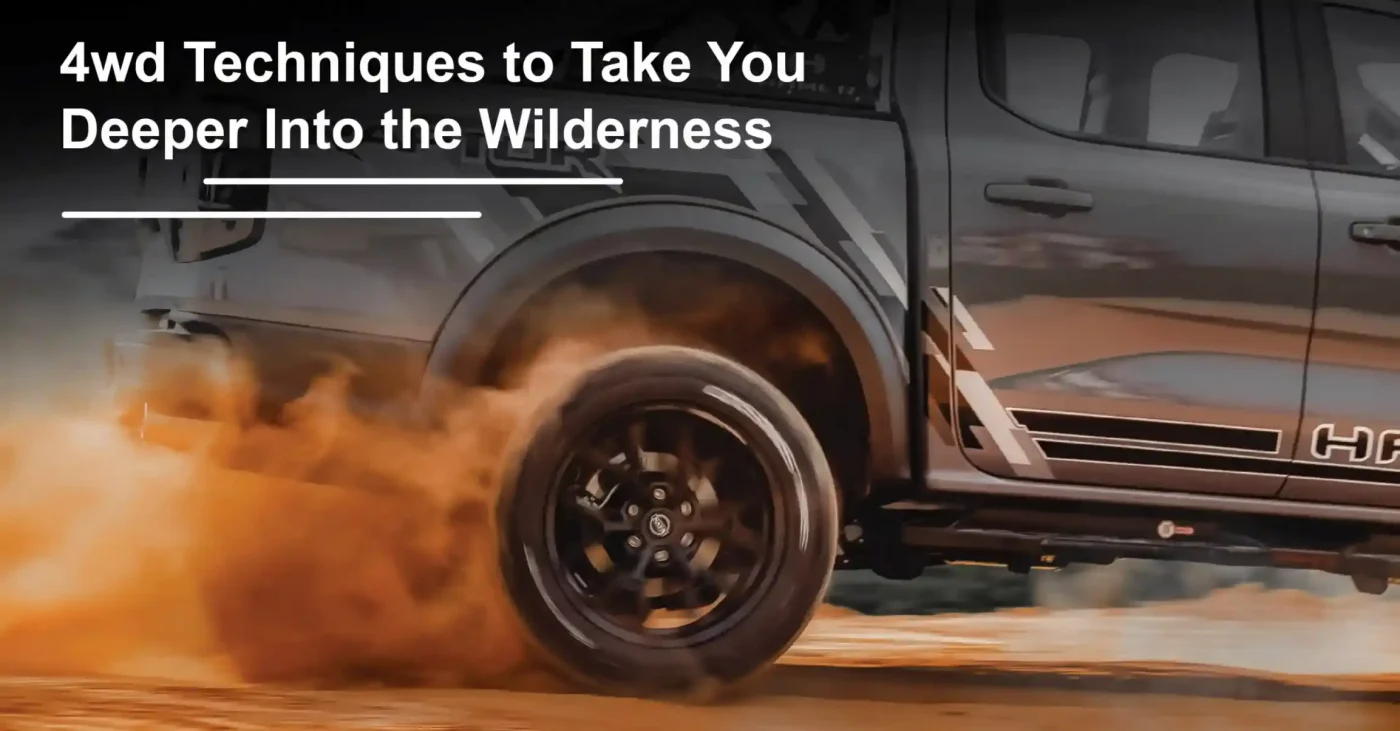 4wd grey ford with wheel arch panel driving in sand